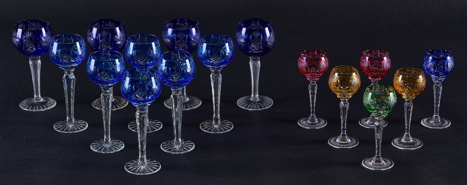 Red McCombs | Collection of (16) Cut-to-Clear Nachtmann After Dinner Wine Glasses: Collection of sixteen cut-to-clear Nachtmann after dinner wine glasses, in various styles, and colors height 5.5 in. / largest Provenance: Property from the personal estate collection of ico