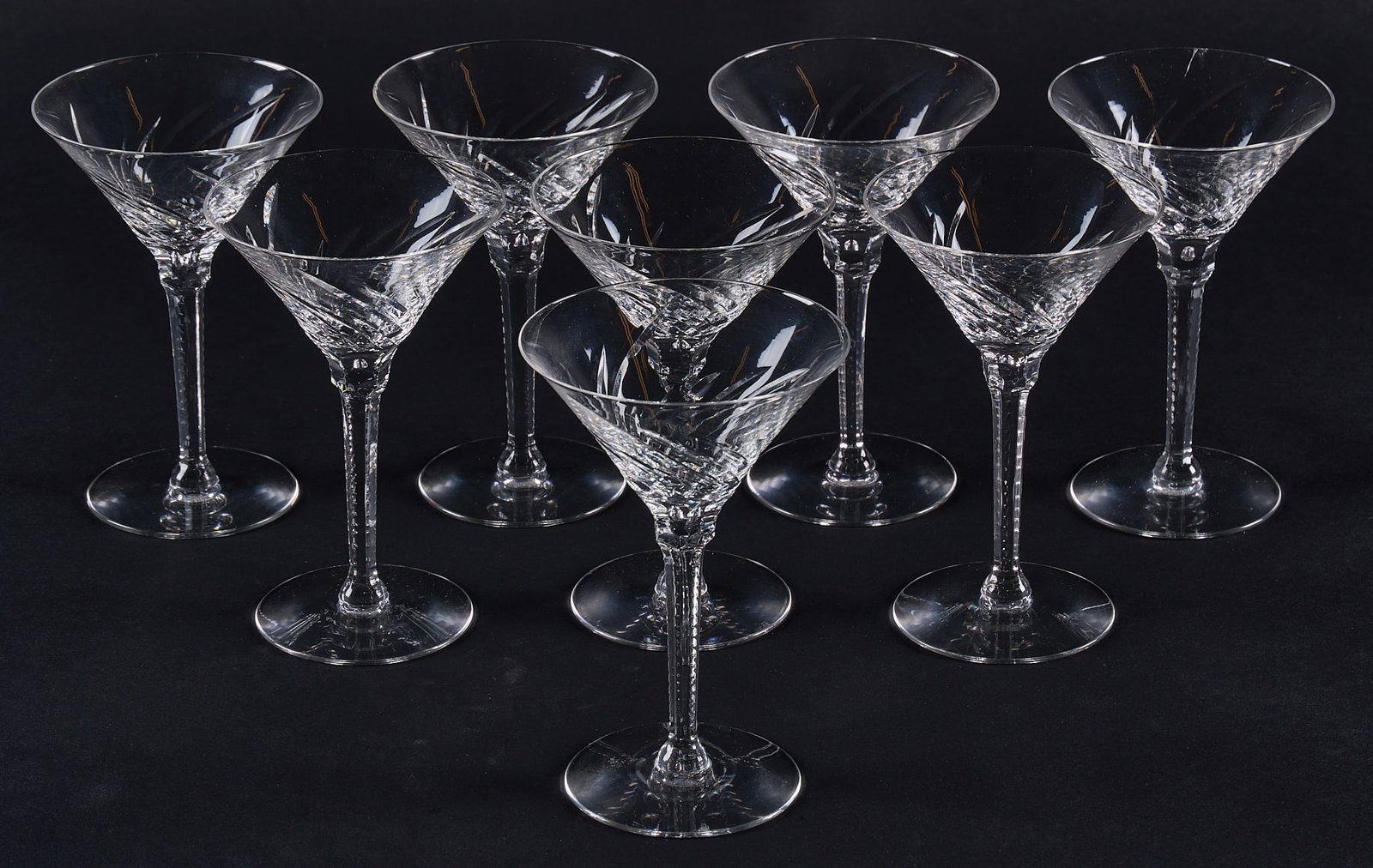 Red McCombs | Collection of (8) Crystal Martini Glasses: Collection of eight crystal martini glasses, with cut swirl bowl height 6 3/8 in. Provenance: Property from the personal estate collection of iconic Texas businessman, civic leader an