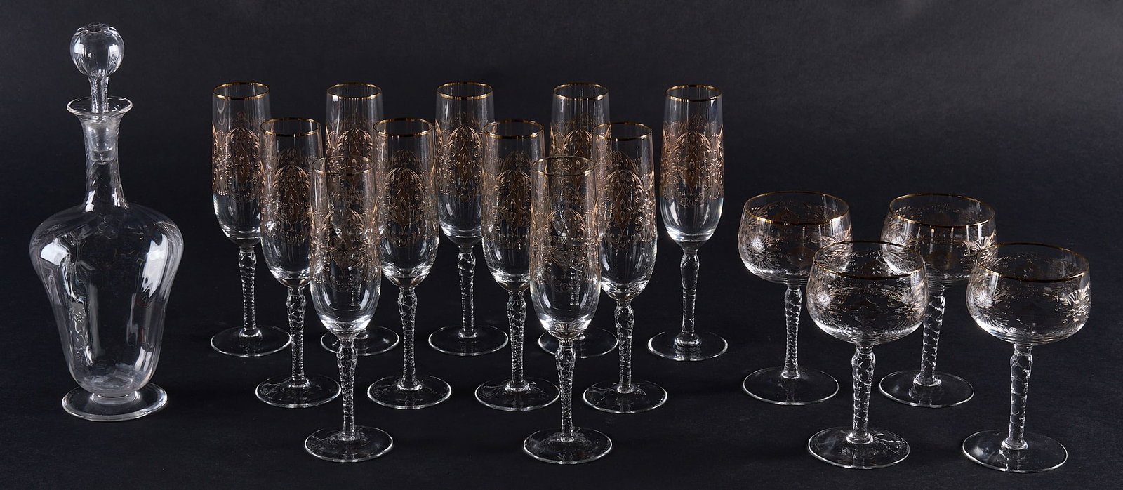 Red McCombs | Collection of Gold Trim Stemware: Collection of champagne glasses with gold tracery embellishment, also includes decanter height 8.5 in. Provenance: Property from the personal estate collection of iconic Texas businessman,