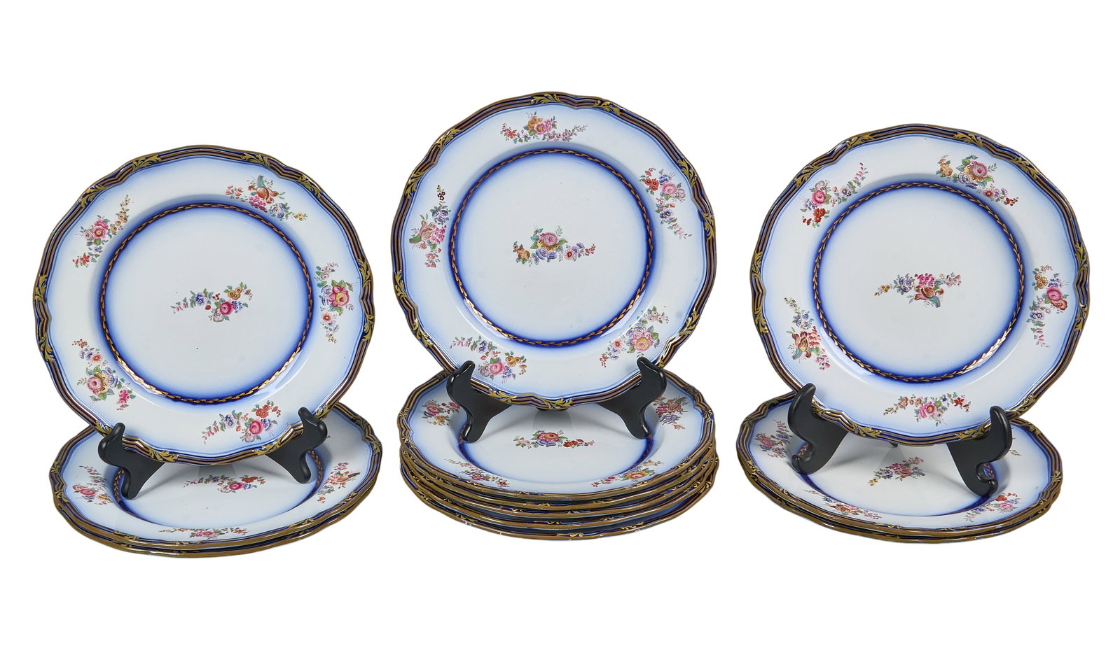 Red McCombs | Set of (12) Hand-Painted French Faience Dinner Plates: Set of twelve hand-painted French faience dinner plates, with floral motifs, and scalloped edges height 1.25 in. x width 10.75 in. x depth 10.75 in. / each Provenance: Property from the personal estat