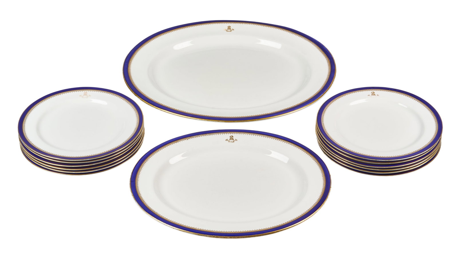 Red McCombs | Royal Worcester Plates and Platter: Royal Worcester porcelain plates and platter, with cobalt and gold borders, and family crest height 1.75 in. x width 18.5 in. x depth 16 in. / largest Provenance: Property from the persona