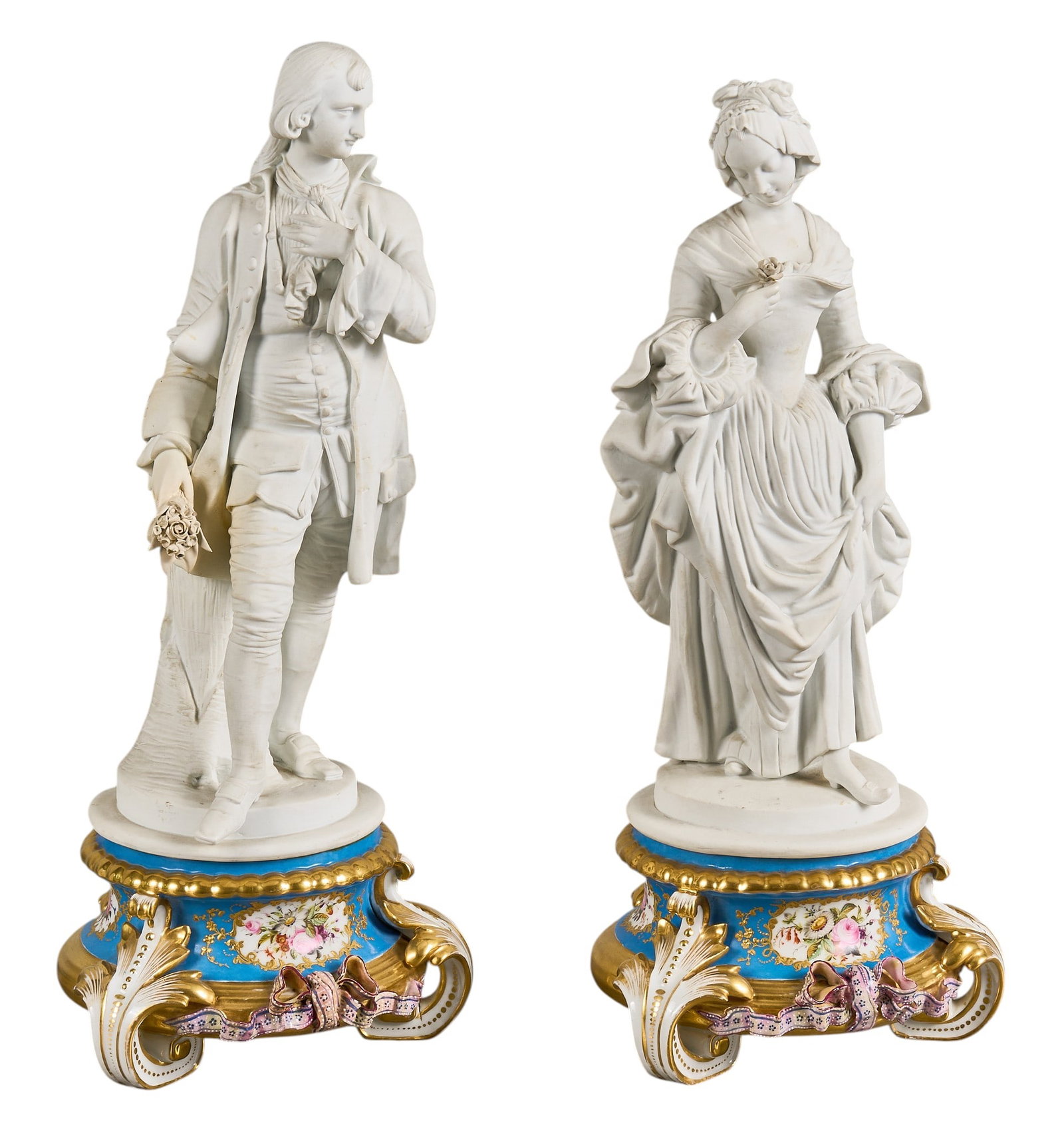 Red McCombs | Pair of Old Paris Courtship Figures: Pair of Continental bisque porcelain figures, finely molded as courting gentleman and lady, mounted on blue porcelain Rococo bases with hand painted floral reserves and gilt highlights height 17 in.