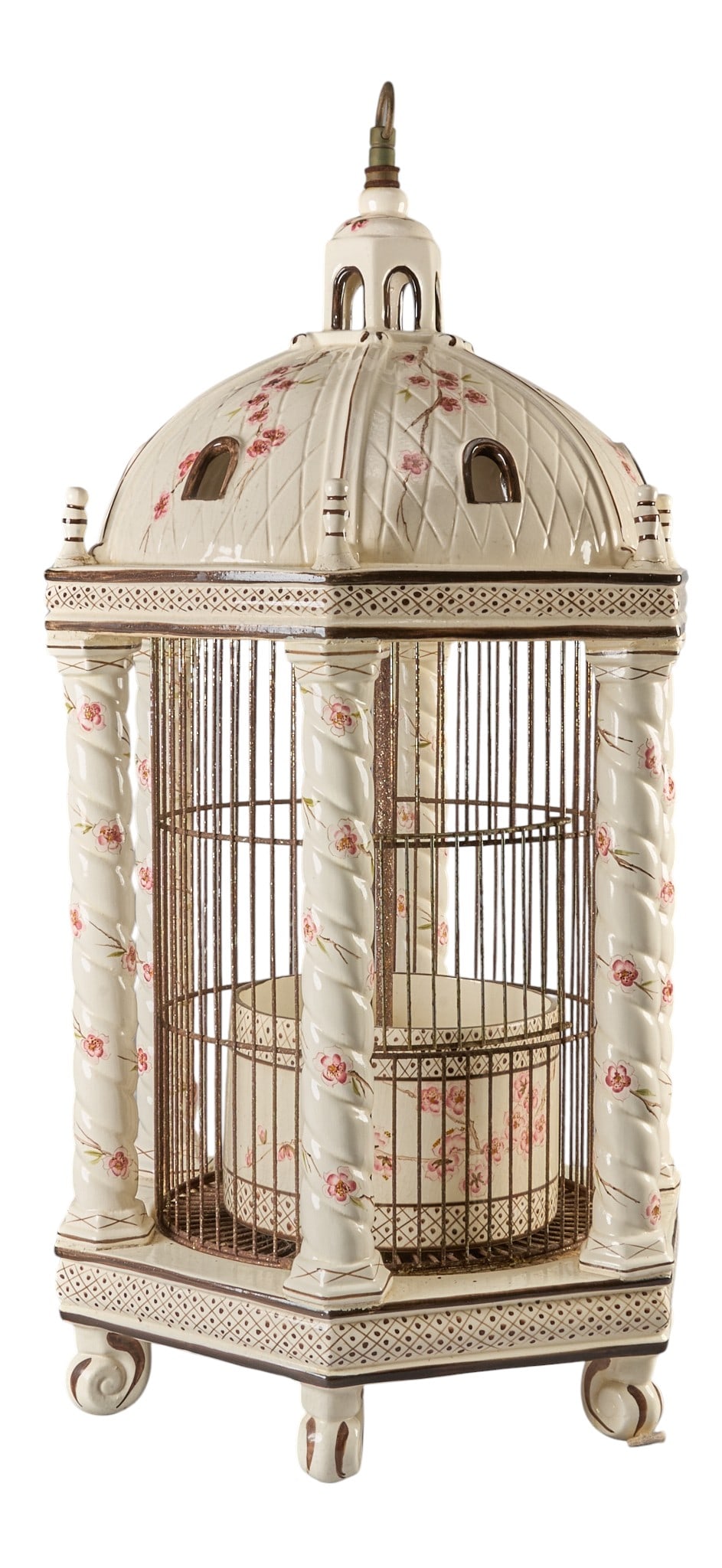 Red McCombs | Italian Birdcage: Italian faience and metal architectural pavilion form birdcage, domed roof over cylindrical metal-bar cage, cream-glazed earthenware body hand painted with pink flowering branches, scroll feet height 