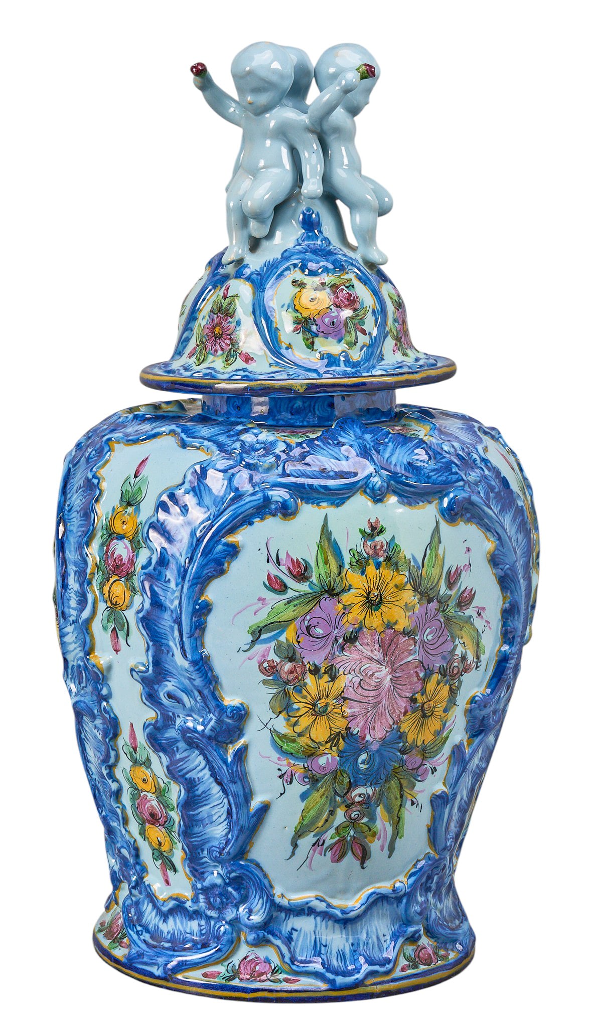 Red McCombs | Alcobaca Faience Covered Urn: Portuguese Alcobaça hand-painted faience covered urn, 20th century, baluster form with molded Rococo-style scrollwork, shell and foliate decoration, polychrome floral reserves on pale blue