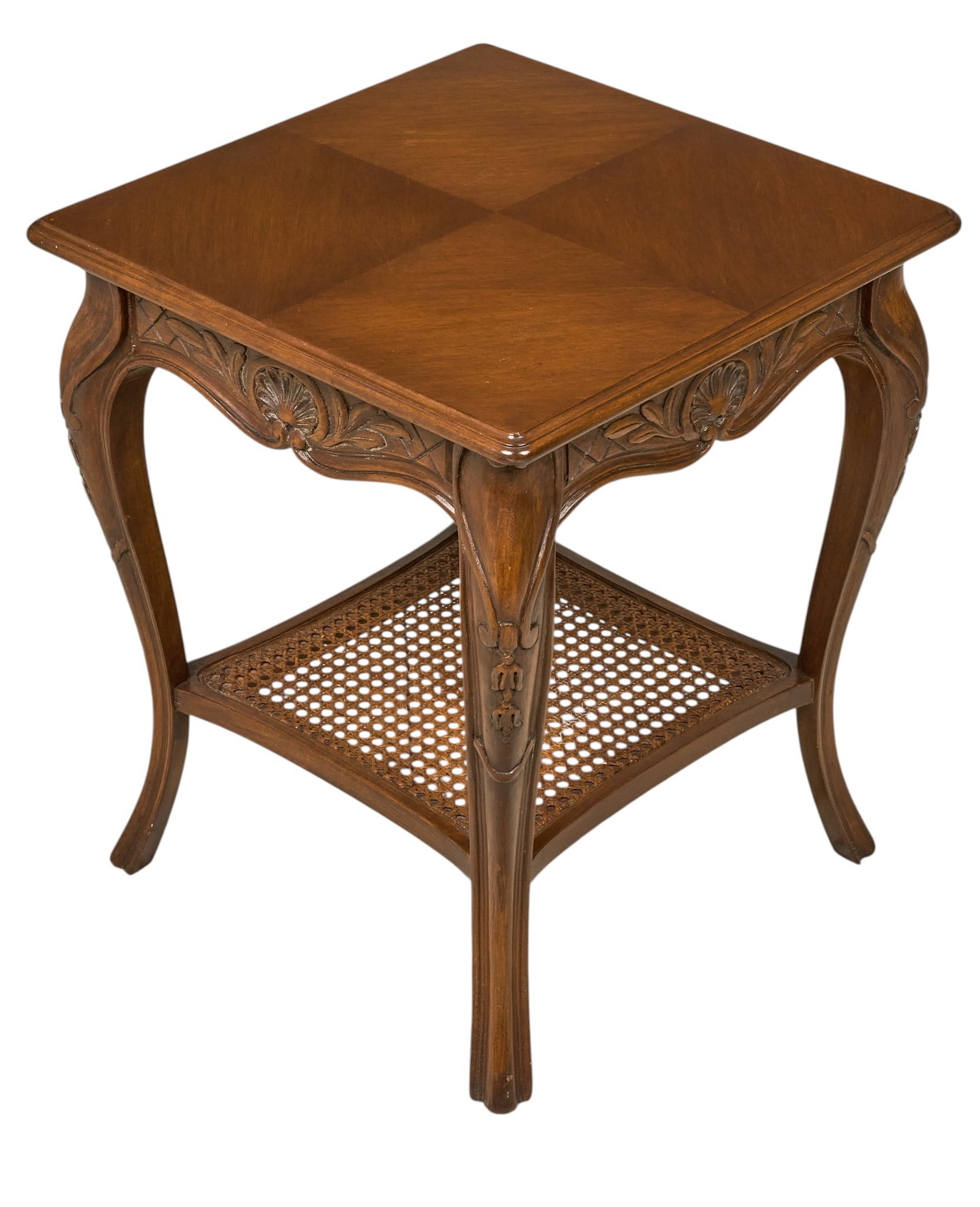 Red McCombs | Vintage French Provincial Style Table: Vintage French Provincial style carved wooden side table with one drawer, and cane shelf height 21 in. x width 18 in. x depth 18 in. Provenance: Property from the personal estate