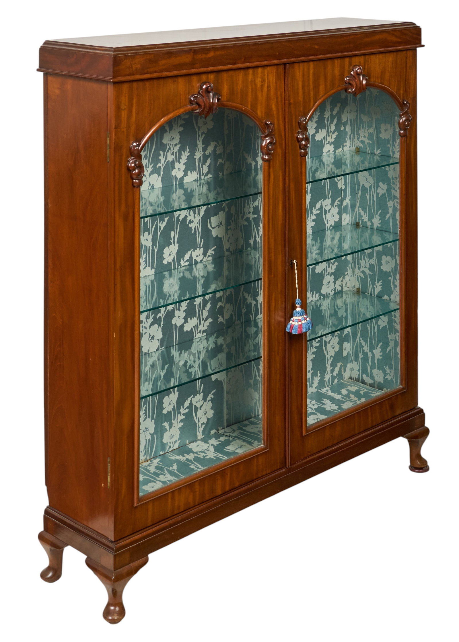 Red McCombs | Vintage Display Cabinet: Vintage glass-front display cabinet with glass shelves, and decorative floral paper lining interior, circa 20th century height 52.5 in. x width 46 in. x depth 12.5 in. Provenance: Property from 