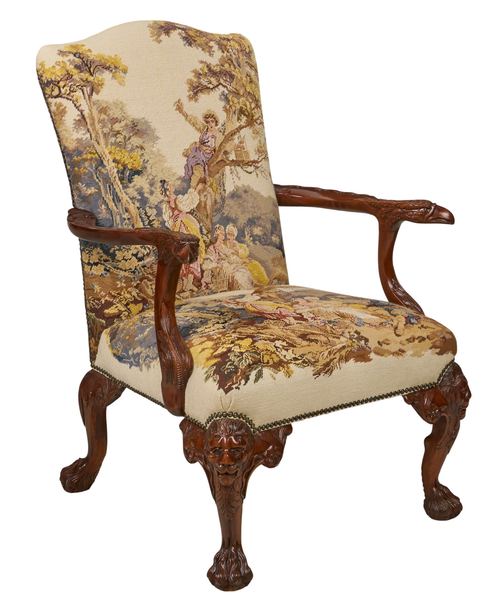 Red McCombs | Georgian Style Needlepoint Armchair: Georgian style needlepoint armchair, and nature scene upholstery with metal nail trim, with intricately carved wooden arms and legs featuring animal motifs height 42 in. x width 30 in. x