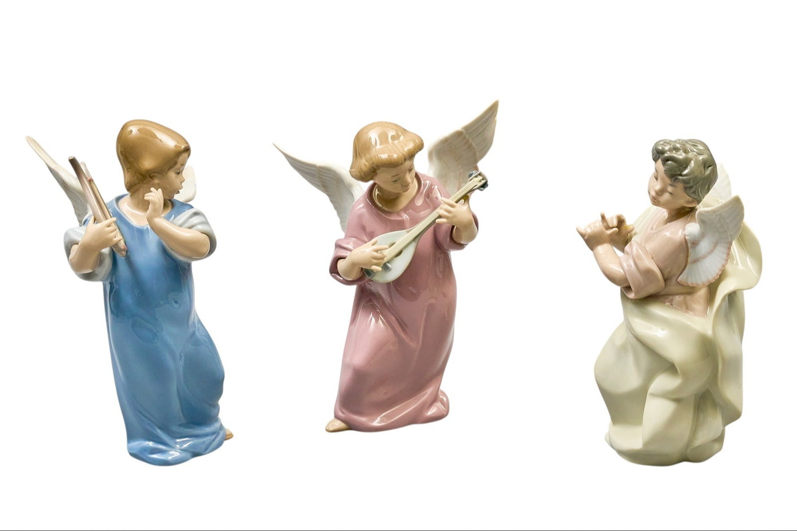 Red McCombs | (3) Lladro Angels: Three Lladro angel sculptures playing instruments, each marked on bottom height 8 in. x width 4 in. x depth 5 in. / largest Provenance: Property from the personal estate collection of iconic