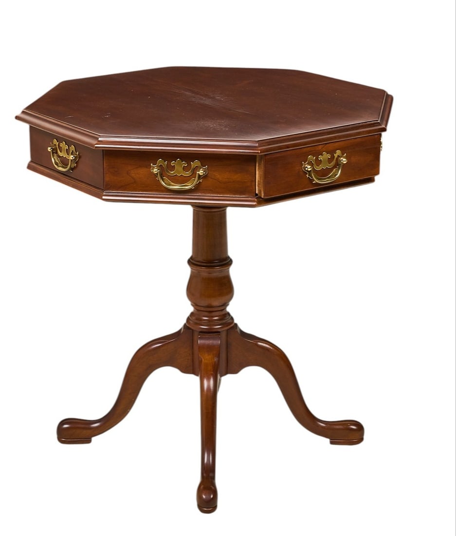 Red McCombs | Occasional Table: Chippendale style occasional table with hexagonal top, with four drawers and four faux drawers, supported on turned pillar and cabriole legs height 28 in. x width 26 in. x depth 26