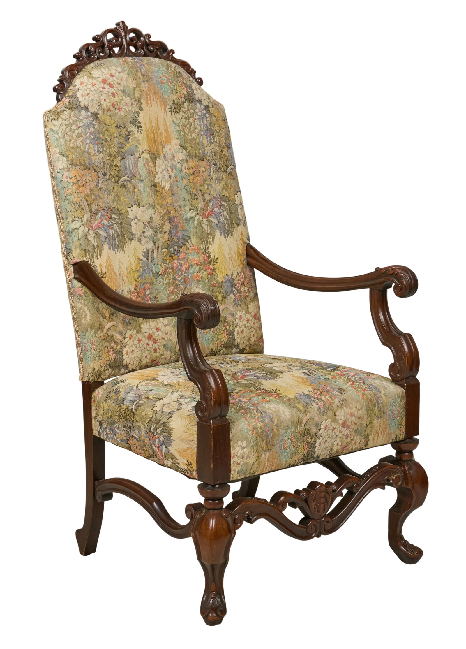 Red McCombs | Victorian Highback Armchair: Victorian high back armchair with decoratively carved frame and floral print upholstery, supported on cabriole legs with sinuous stretcher height 51 in. x width 26 in. x depth 30 in. Provenance: