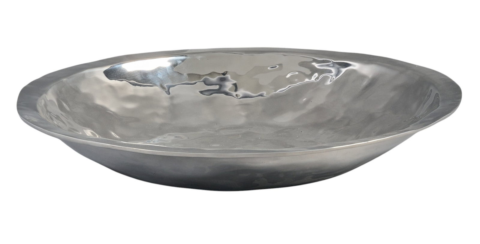 Red McCombs | Mexican Dish: Large reflective silver metal dish, made in Taxco, Mexico, marked with sticker on bottom diameter 21 in. x depth 3.5 in. Provenance: Property from the personal estate collection of iconic Texas