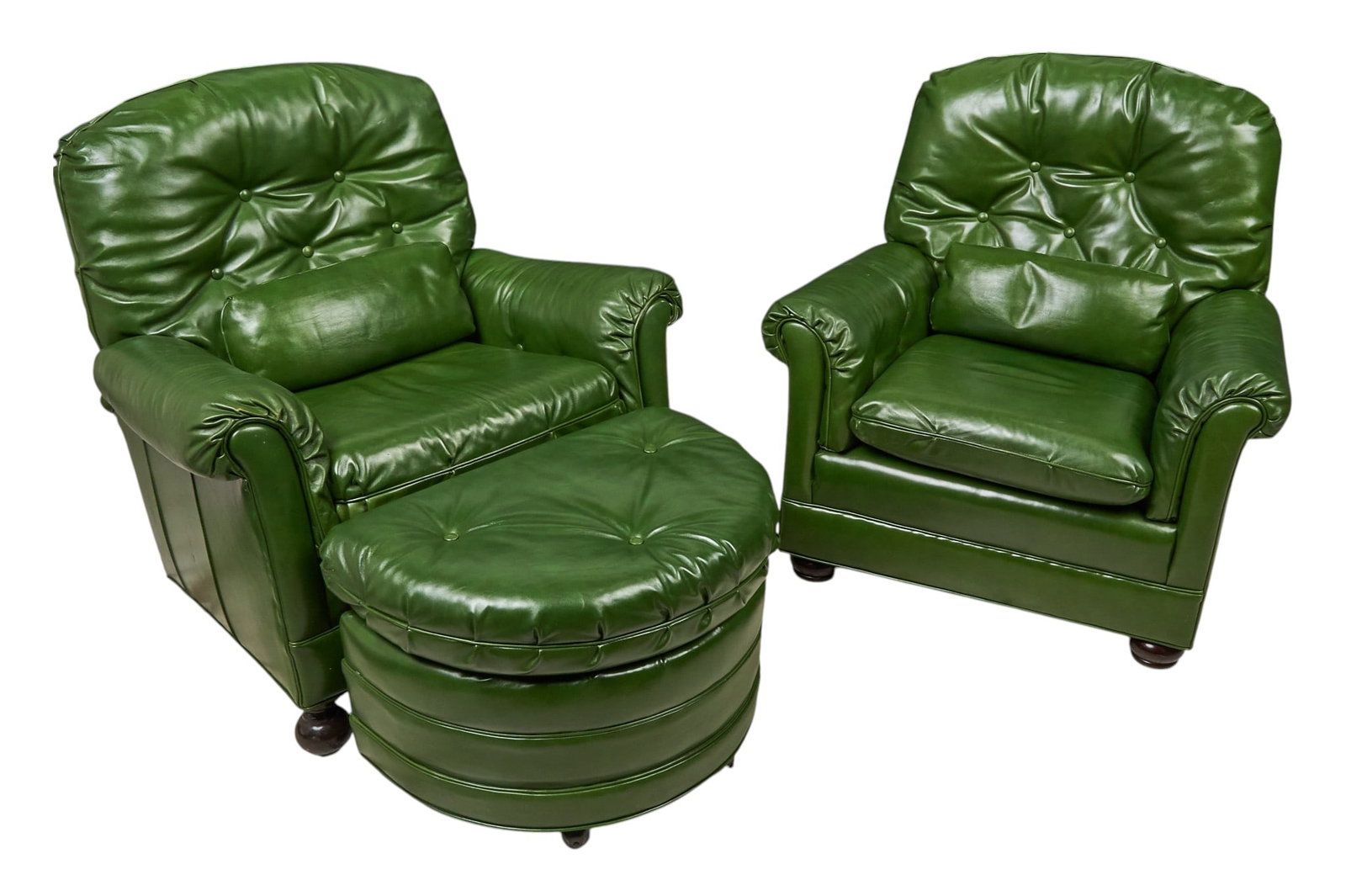 Red McCombs | Pair of Green Leather Armchairs and Ottoman: Pair of tufted green leather armchairs and ottoman, supported on front bun feet, with National Association of Professional Upholsterers label on underside height 37 in. x width 37 in. x depth 29
