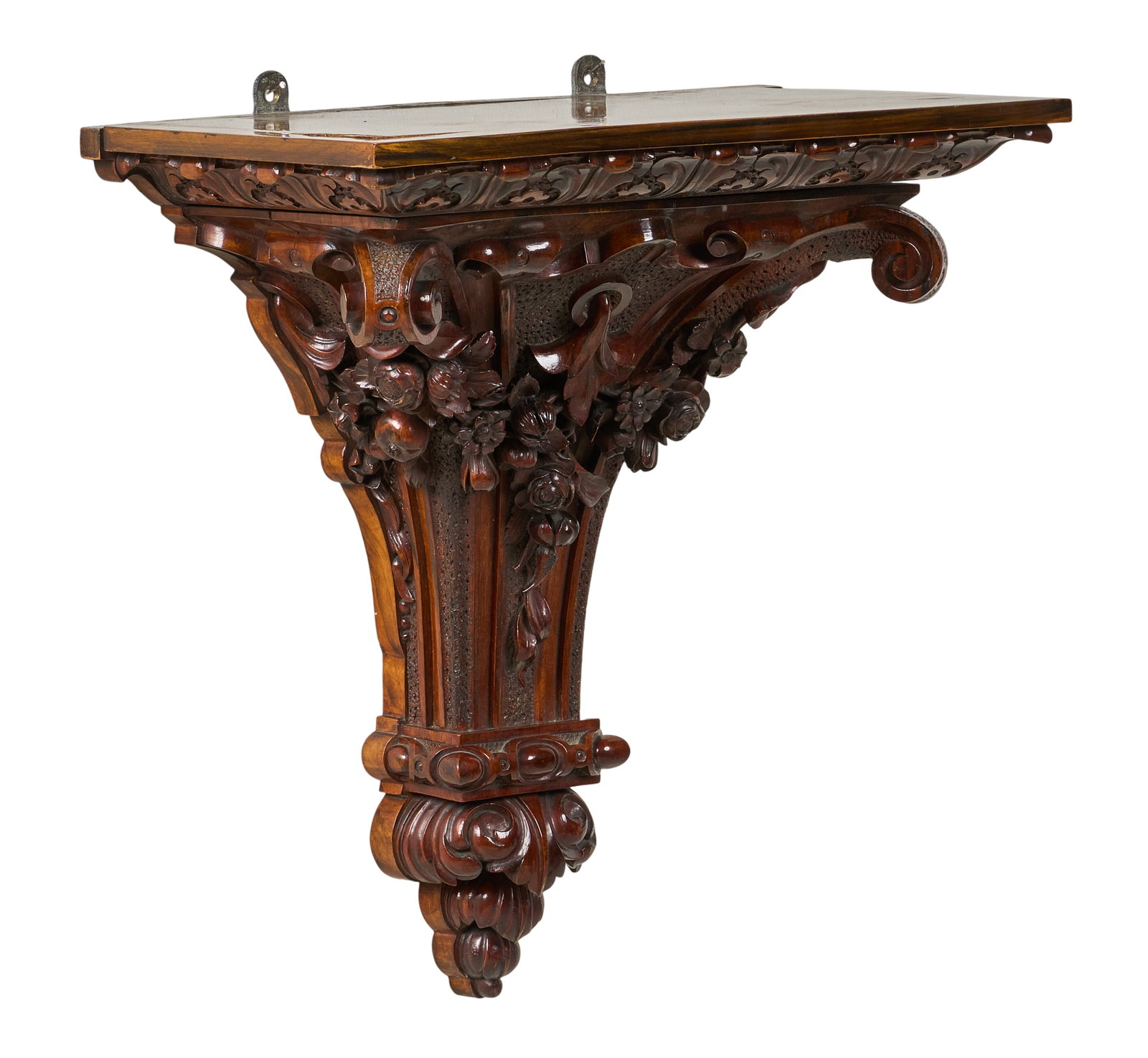 Red McCombs | Carved Wall Shelf: Heavily carved wooden wall shelf featuring ornate floral motifs height 20 in. x width 18.5 in. x depth 10.5 in. Provenance: Property from the personal estate collection of iconic Texas