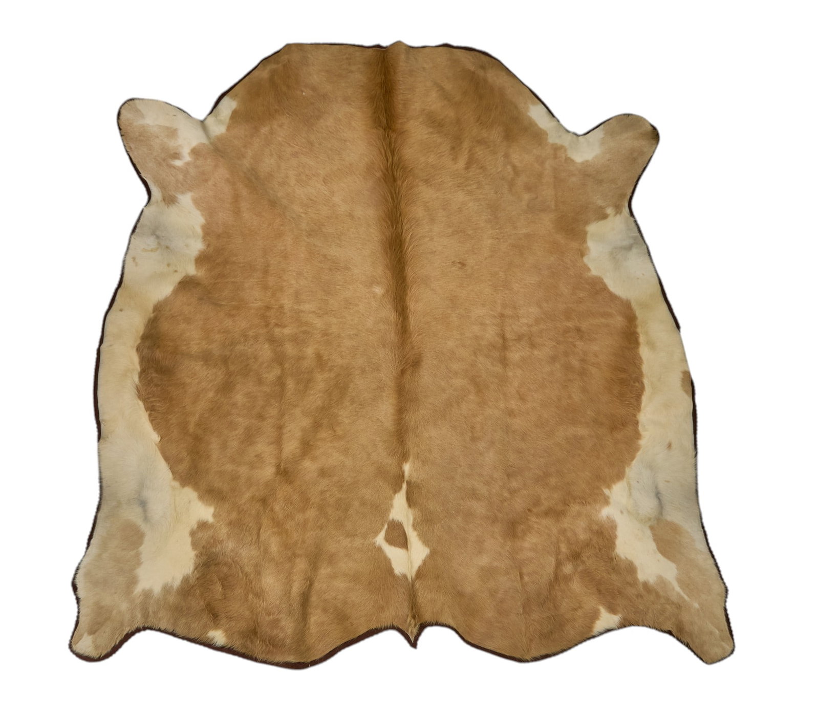 Red McCombs | Cowhide Rug, 7 ft. 8 in. x 7 ft. 5 in.: Cowhide rug with felt lining 7 ft. 8 in. x 7 ft. 5 in. Provenance: Property from the personal estate collection of iconic Texas businessman, civic leader and philanthropist Billy Joe Red