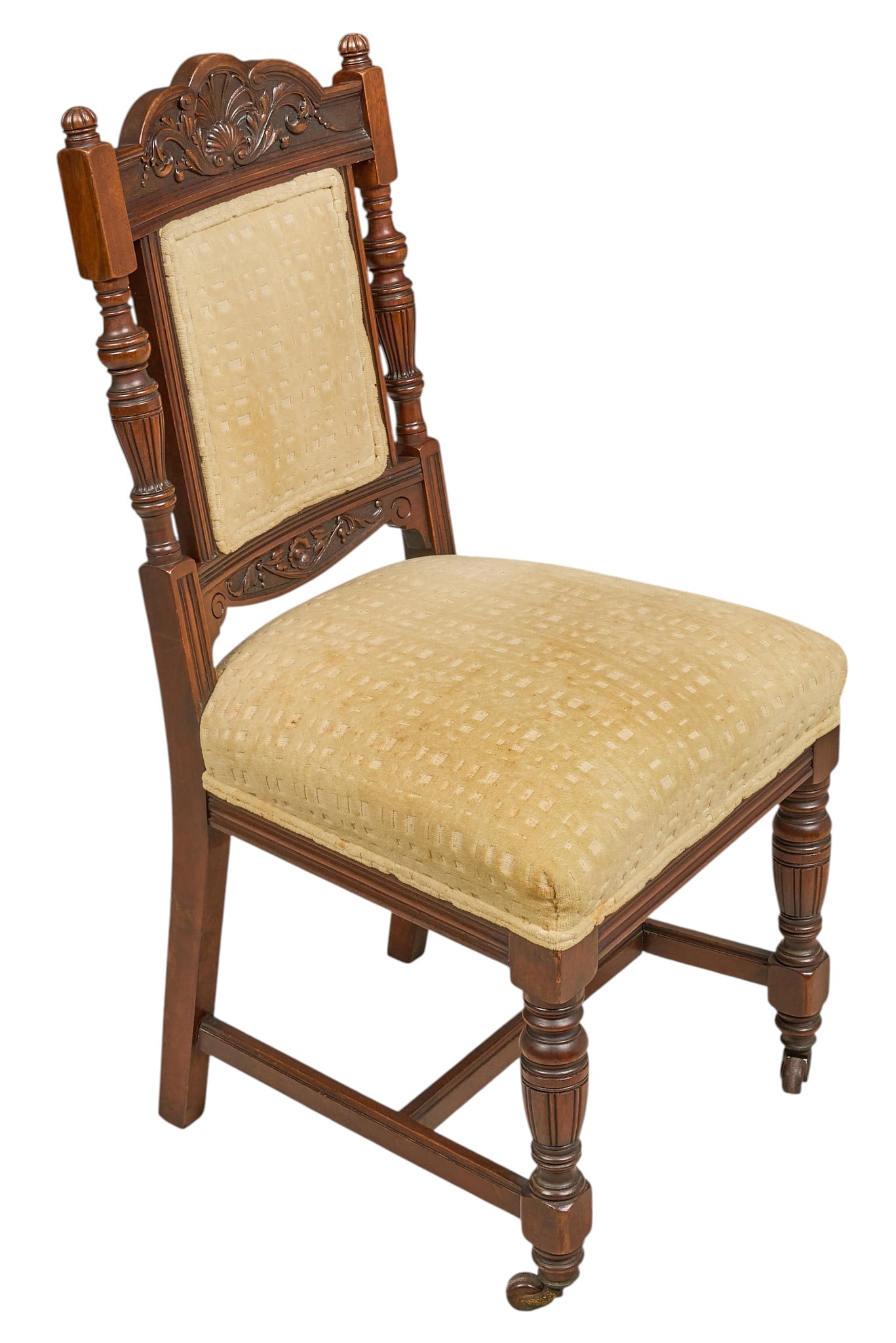 Red McCombs | Eastlake Parlor Chair: Victorian carved wooden chair with cream upholstered seat, foliate-carved crest, fluted front legs with casters height 39 x width 19.5 x depth 20 Provenance: Property from the personal