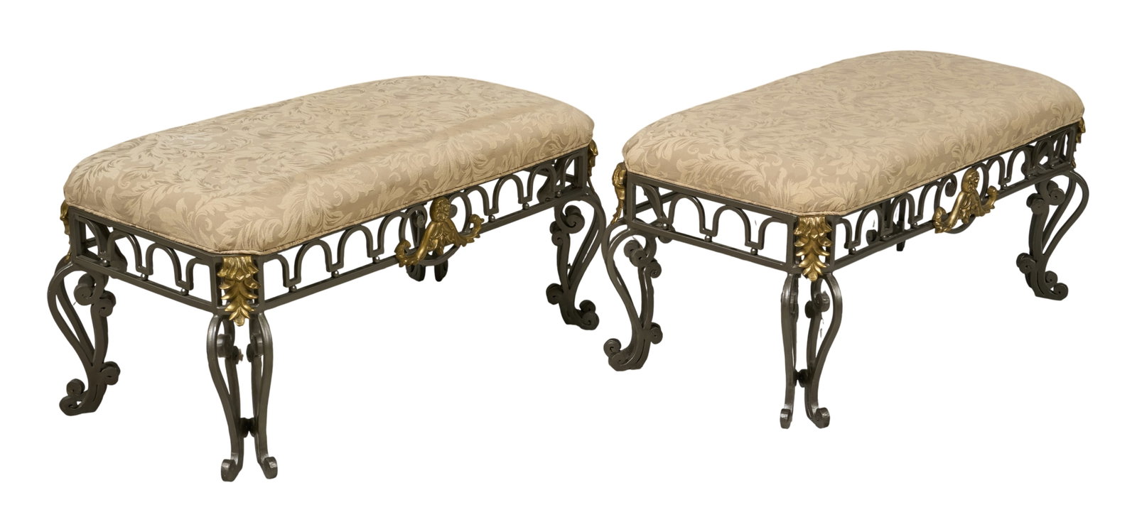 Red McCombs | Pair of Italian Ottomans: Pair of Italian ottoman with cushioned seat supported on iron bases height 18 in. x width 39 in. x depth 20 in. Provenance: Property from the personal estate collection of iconic Texas businessm
