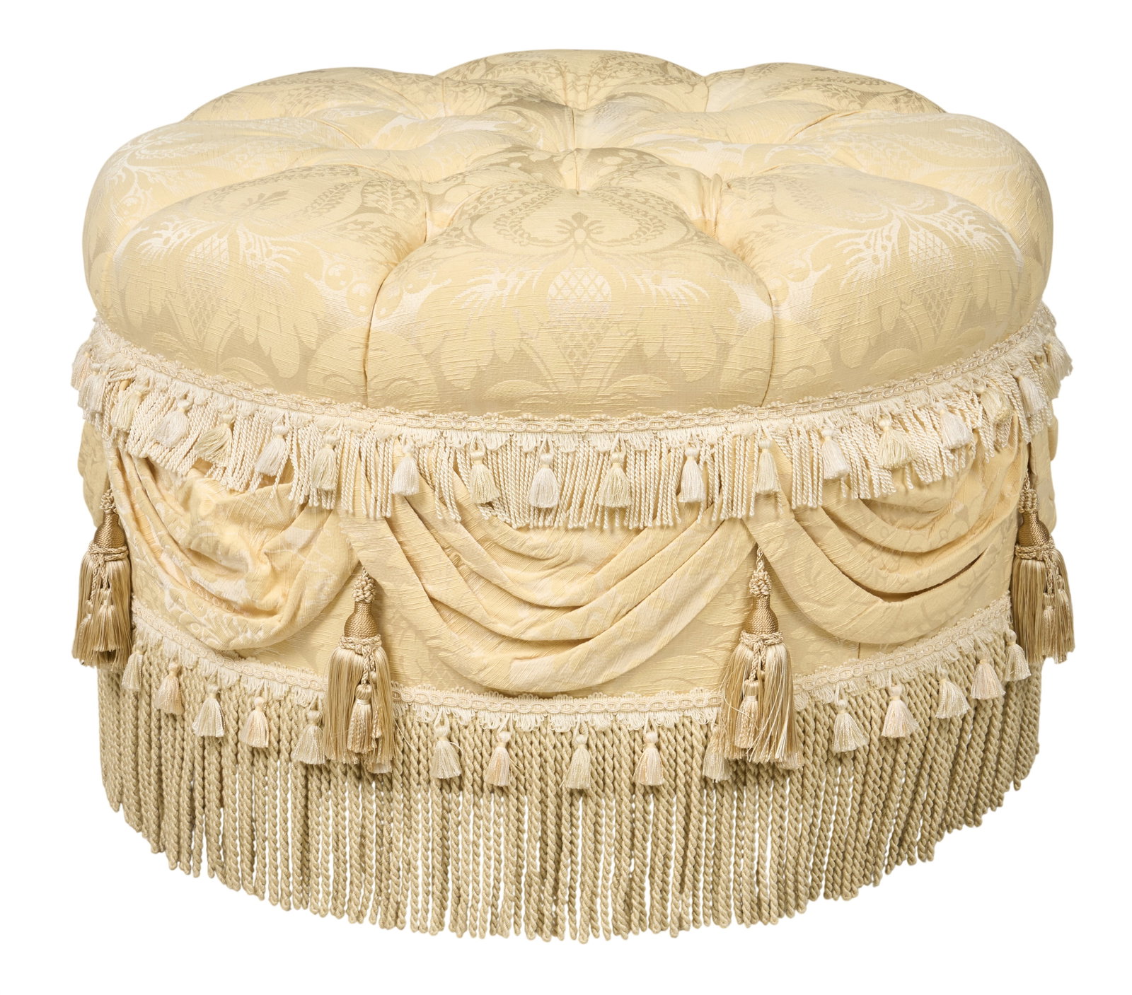 Red McCombs | Tufted Damask Ottoman: Large white ottoman with upholstered damask tufted top, and decorative trim with draping and fringe trim height 24 in. x width 34 in. x depth 34 in. Provenance: Property from the