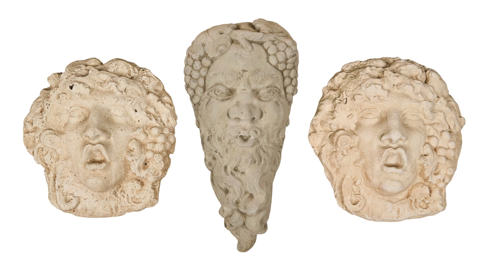 Red McCombs | (3) Architectural Wall Masks: Three classical style cast concrete architectural wall masks depicting Dionysus, the Greco-Roman god of wine, shown with grapes and grapevine motifs height 23 in. x width 11 in. x depth 6 in. / l