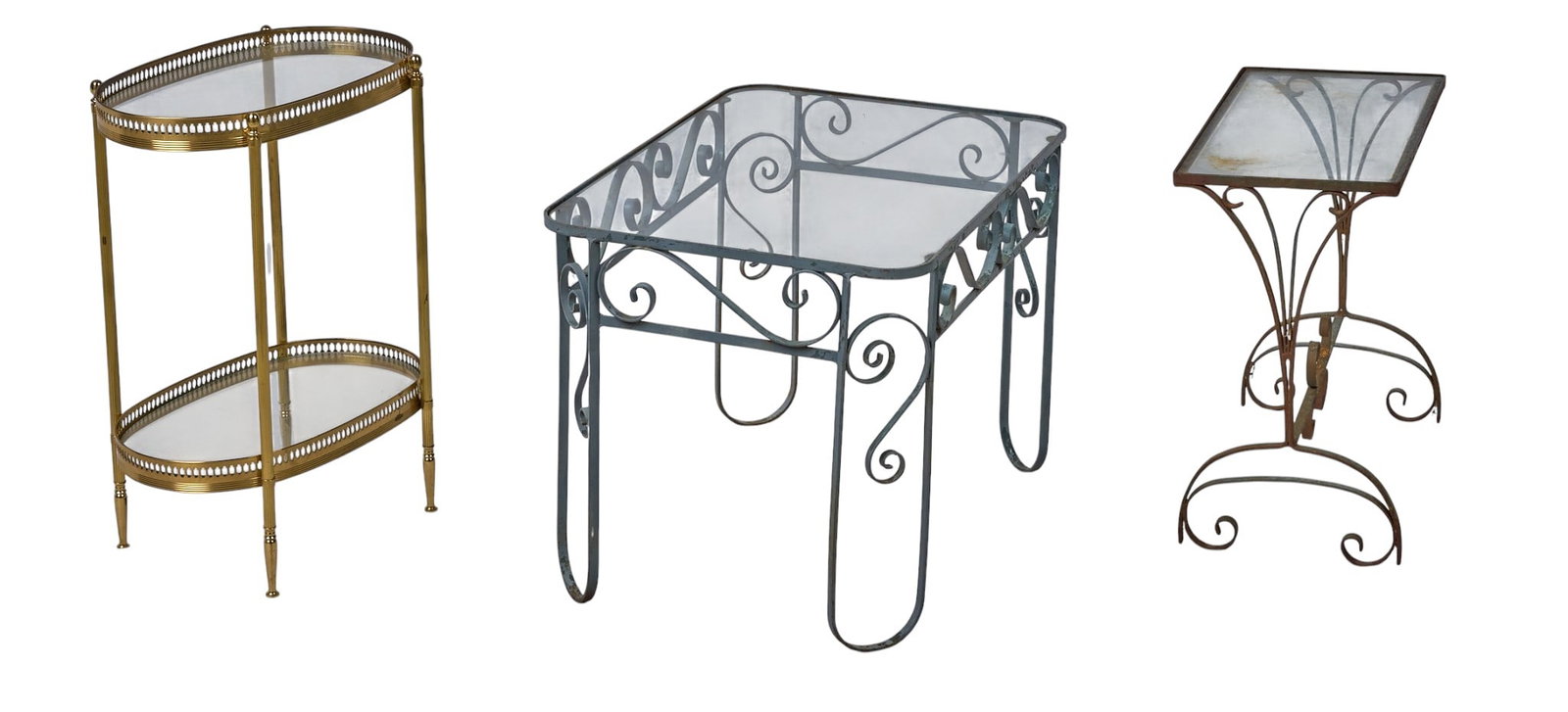 Red McCombs | (3) Glass Side Tables: Collection of three glass tables, includes gold tiered table with two glass shelves, wrought iron table with scroll details, and rectangular top table with curved stretcher legs height 18.5 in. x