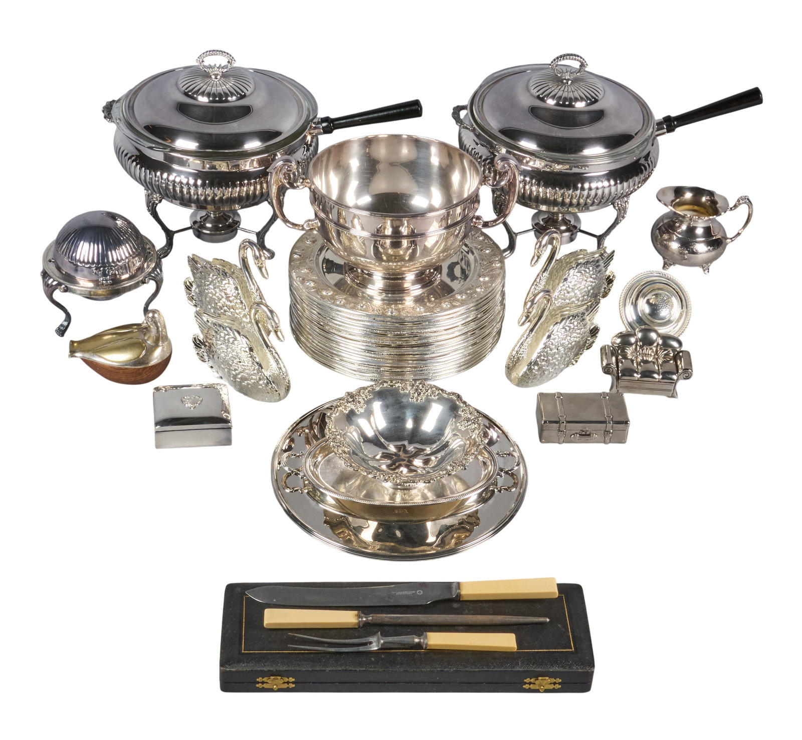Red McCombs | Collection of Vintage Silverplate Holloware: Collection of vintage silverplate holloware, featuring chafing dishes, a large centerpiece bowl, serving dishes, a creamer, and a carving set height 0.5 in. x diameter 12 in. / largest Prove