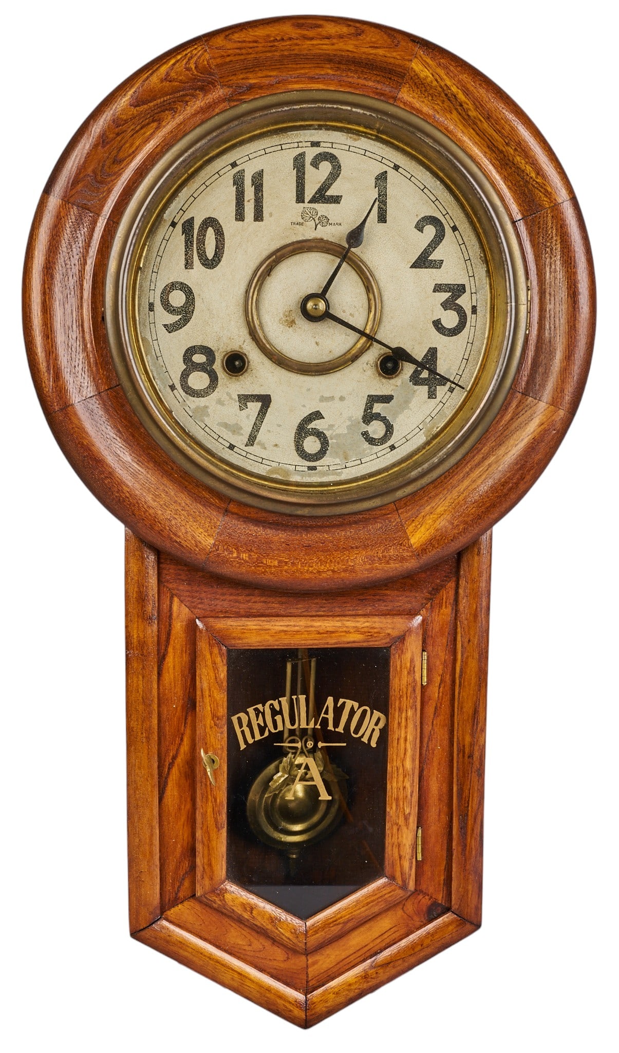 Red McCombs | Vintage Regulator A Wall Clock: Vintage wooden "Regulator A" drop-dial wall clock featuring a brass bezel, an enameled Arabic numeral dial, and a visible pendulum height 22 in. x width 12 in. x depth 5.25 in. Provena