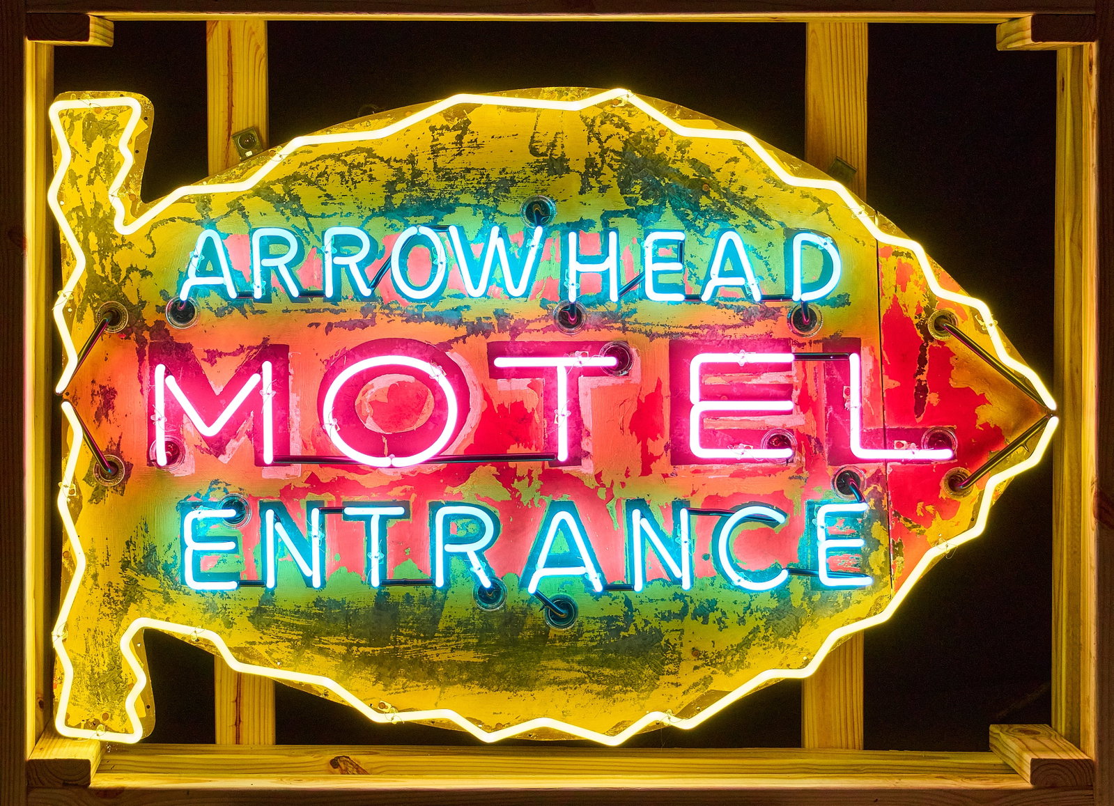 Arrowhead Motel Entrance Neon Sign: Arrowhead Motel neon sign, single-sided, was one a single-double sided sign that was divided, and installed with neon tubing height 36 in. x width 57 in. x depth 9 in. Provenance: