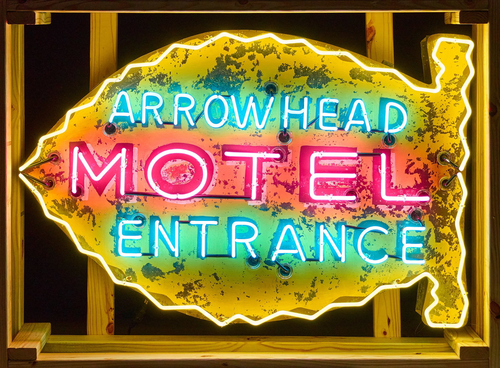Arrowhead Motel Entrance Neon Sign: Arrowhead Motel neon sign, single-sided, was one a single-double sided sign that was divided, and installed with neon tubing height 36 in. x width 57 in. x depth 9 in. Provenance: