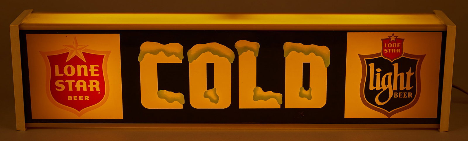 Lone Star Beer "Cold" Backlit Sign: Lone Star Beer "Cold" backlit sign, in working condition height 6 in. x width 24 in. x depth 4 in. Provenance: Property from a home in San Antonio, Texas 
