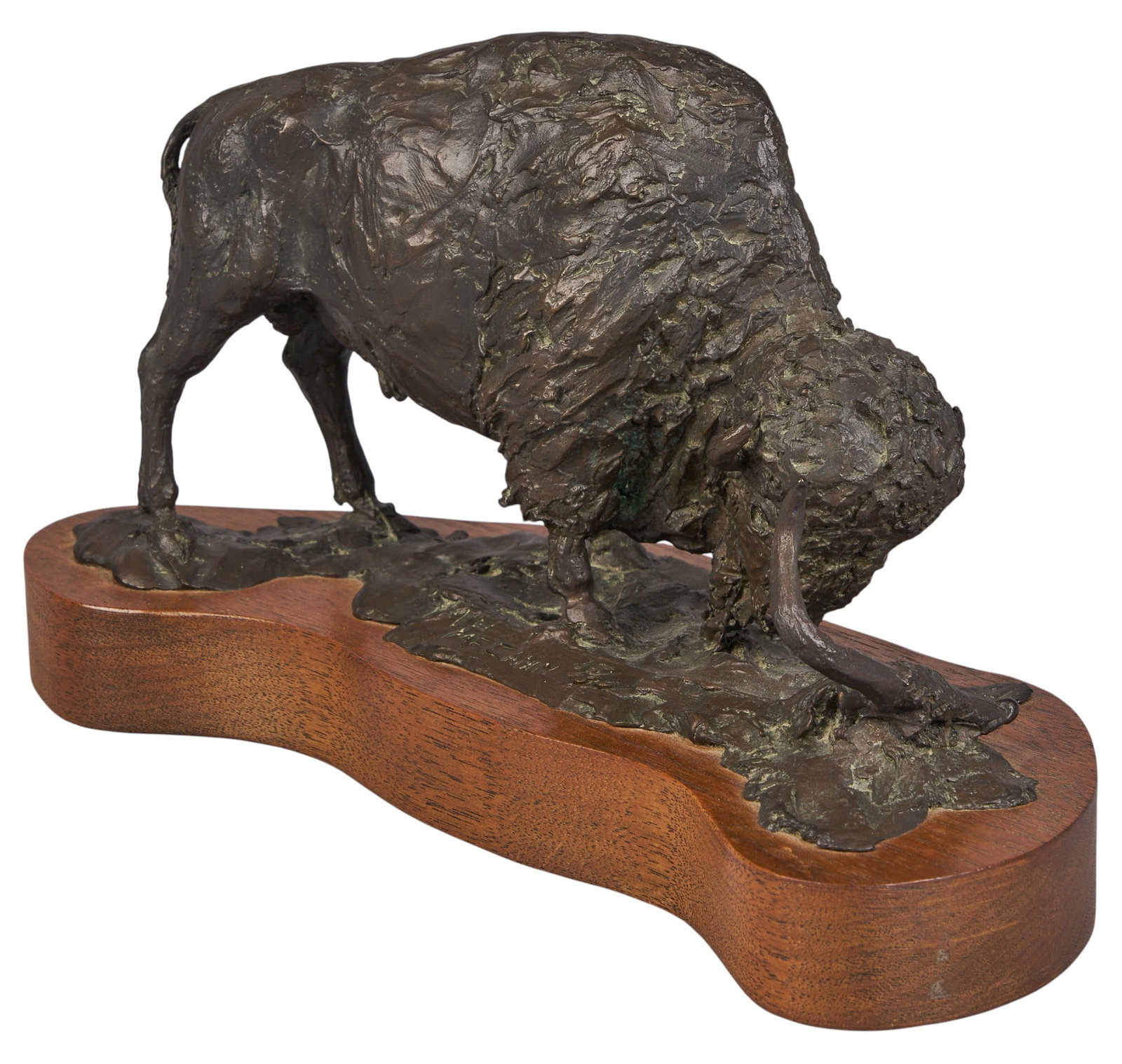 L. P. McCann, Bison Bronze: L. P. McCann (Amer., b. 20th C.), bison examining longhorn skull, artist-cast bronze sculpture on wooden base, with incised signature and edition number 15/30 height 6 in. x width 10 in. x depth 