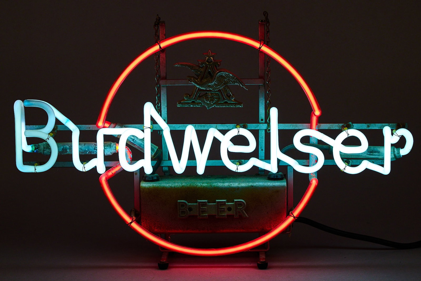 Rare Budwieser Neon Sign: Rare Budweiser neon sign, with original "ruby red" tubing, and cast iron Anheuser-Busch (St. Louis, Missouri) hanging plaque height 15 in. x width 24 in. x depth 5 in. 