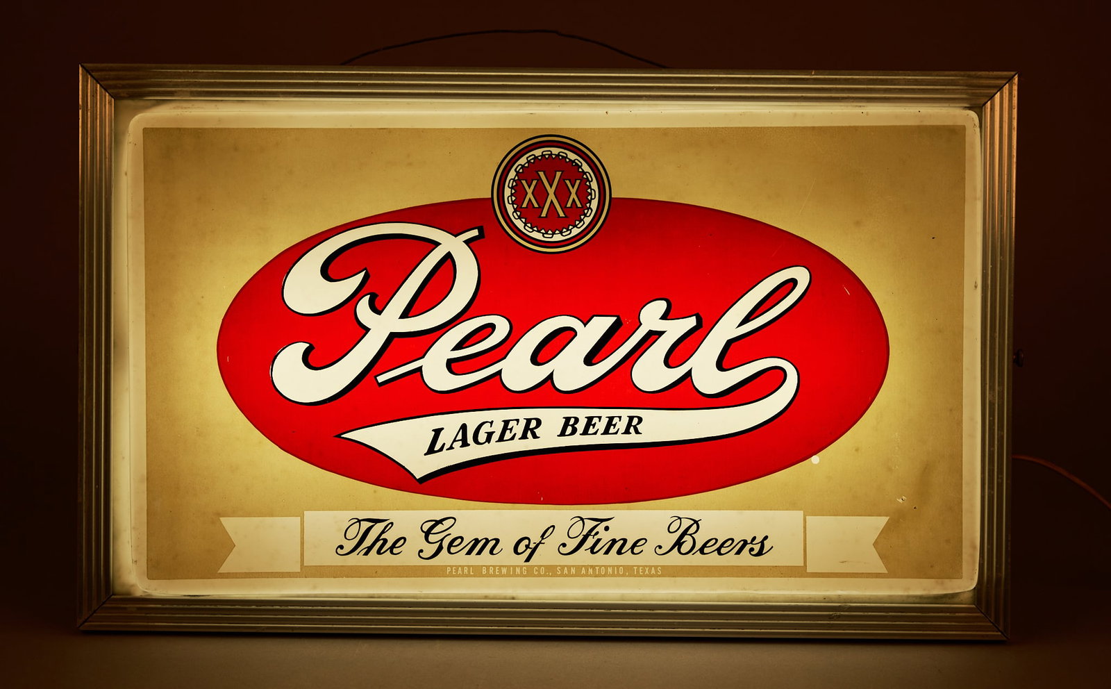 Pearl "The Gem of Fine Beers" Lighted Sign: Pearl "The Gem of Fine Beers" lighted sign, in working condition height 4 in. x width 20 in. x depth 12 in. Provenance: Property from a home in San Antonio, Texas