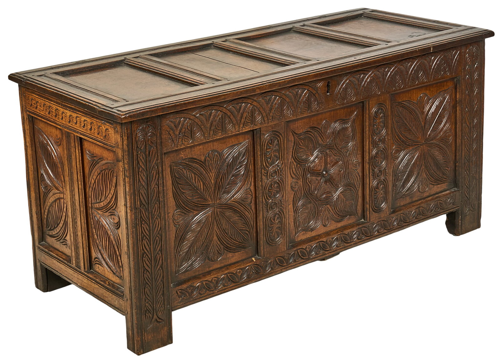 Carved Wooden Jacobean Coffer: Ornately carved wooden English Jacobean coffer supported on block legs height 27 in. x width 55 in. x depth 25 in. Provenance: The estate of prominent Austin, Texas attorney George Cowden