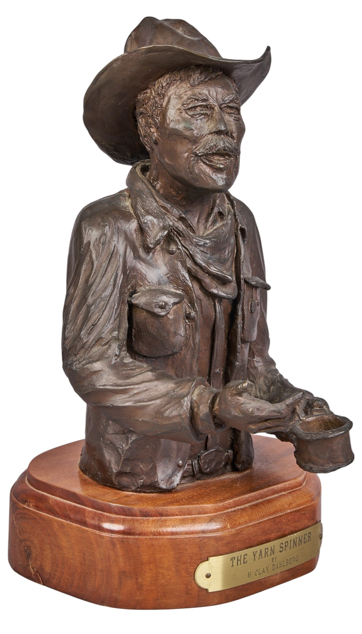 H. Clay Dahlberg, "The Yarn Spinner": H. Clay Dahlberg (Texas, b. 1946), "The Yarn Spinner", artist-cast bronze sculpture on wooden base, with incised signature, edition number 6/10, and date, 1973 height 8 in. x width 6