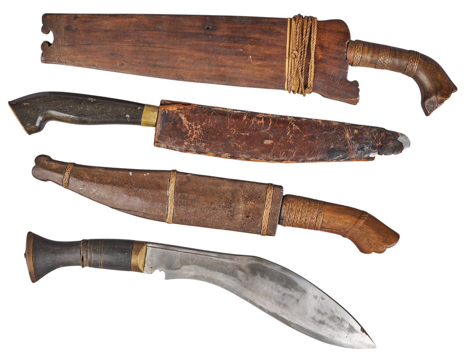 (4) Vintage Filipino Daggers: Four vintage Filipino daggers, various styles, three with sheaths length 17 in. x width 4 in. / largest Provenance: Property from a home in San Antonio, Texas 
