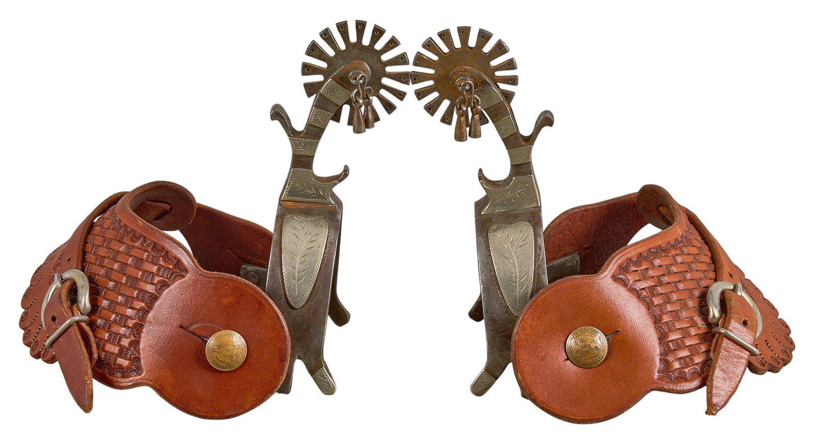 Pair of Rare L.J. Church Bottle Opener Spurs: Pair of L.J. Church bottle opener spurs, with silver overlay, Mexican coin motif buttons, tooled leather heel strap, marked "L.J. Church", "Belle. Fourche S. D." overall