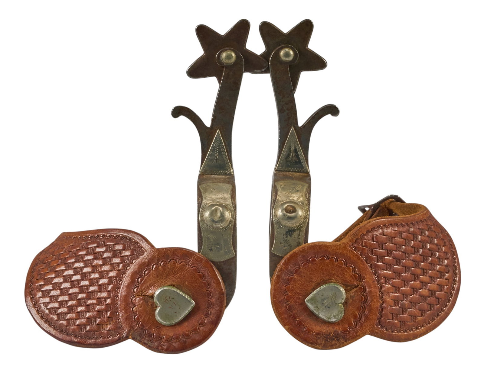 Pair of North & Judd Star and Forged Steel Spurs: North & Judd star and forged steels spurs, with silver overlay, heart buttons, tooled leather heel straps, maker marked overall length: 7 in. heel width: 3 in. rowel diameter: 2