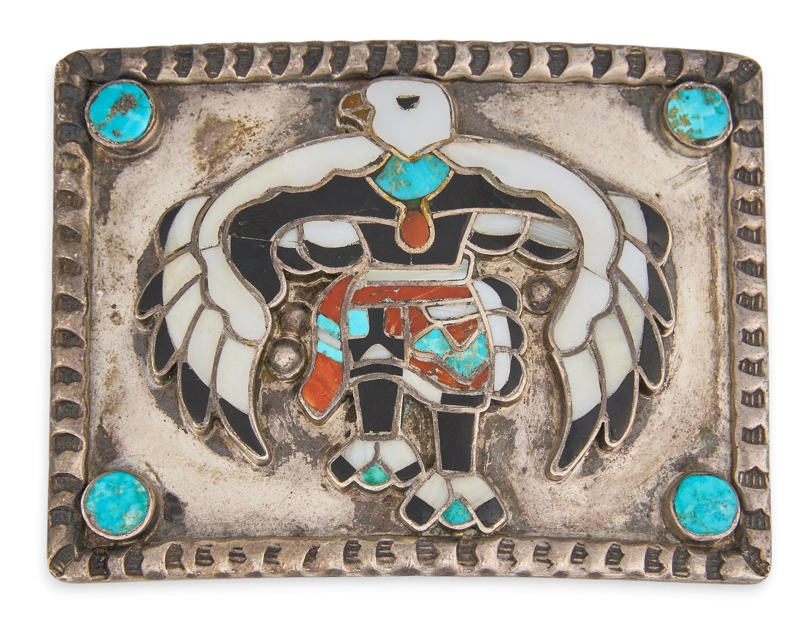 Sterling & Multi-Stone Inlay Eagle Dancer Buckle: Sterling silver buckle depicting eagle dancer motif, set with multi-stone inlay and turquoise cabochons to corners Size: 3 in. x 2.25 in. Total weight: 76.4 g Provenance: Property from a home in San