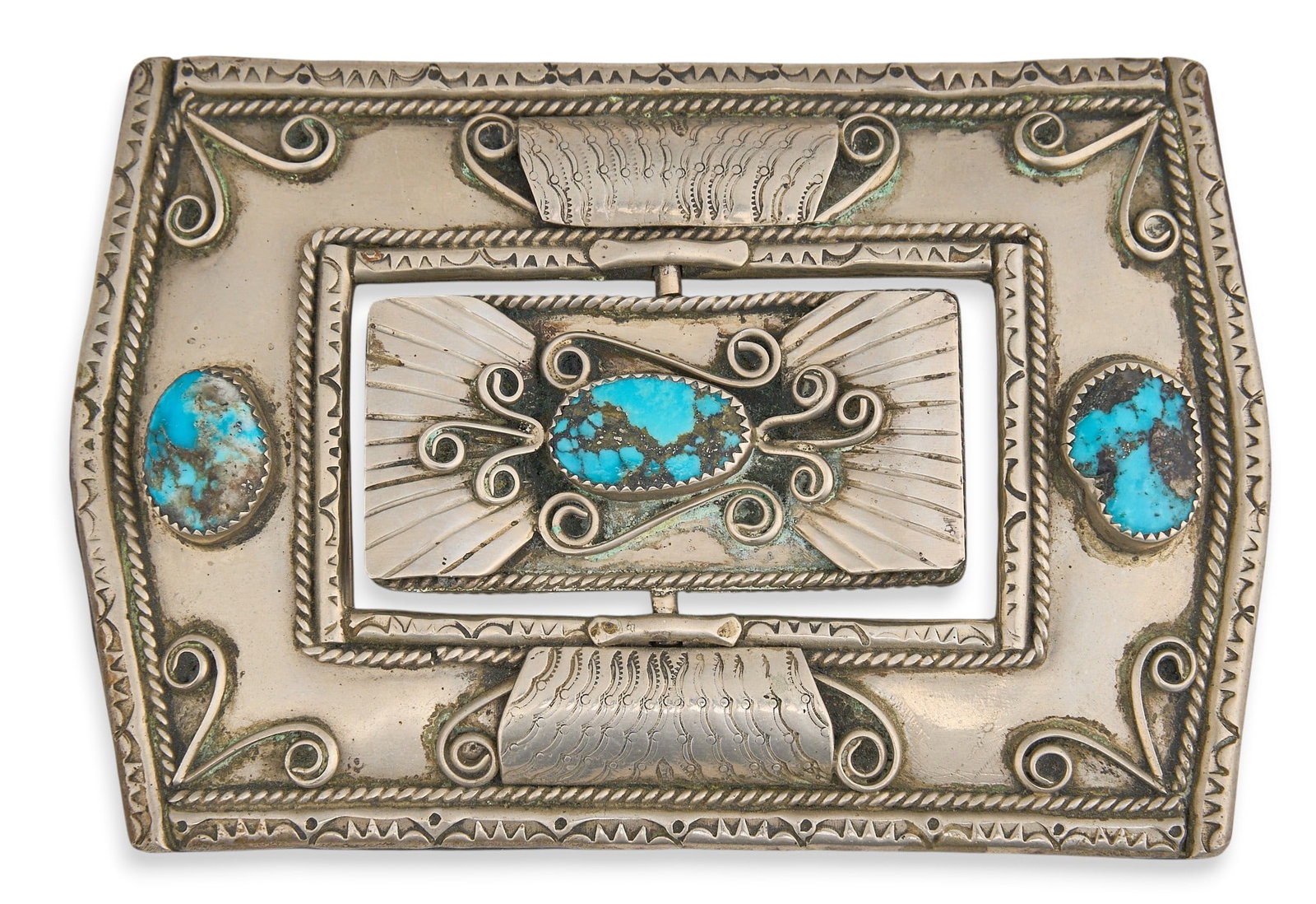 Substantial Sterling & Multi-Stone Reversible Buckle: Substantial sterling silver buckle set with two turquoise stones, twisted wire motifs, and hand-stamped details, featuring central reversible element set with turquoise and coral Size: 4.5 in. x