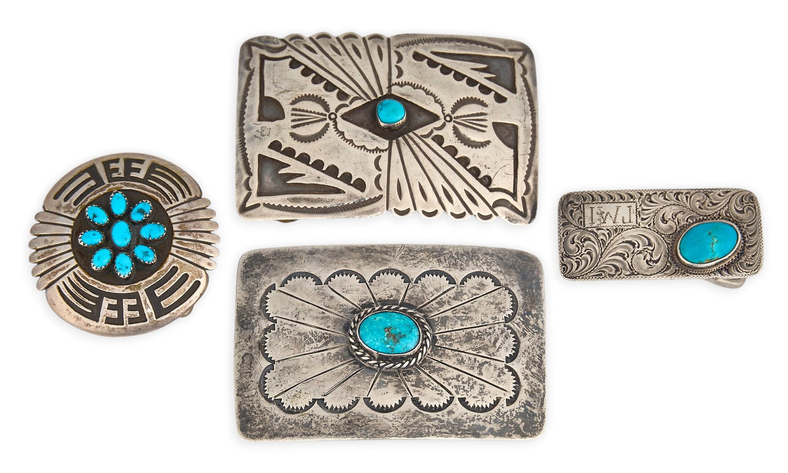 (4) Southwestern Sterling & Turquoise Buckles: Four Southwestern sterling silver buckles, each set with turquoise cabochons, featuring etched and stamped details, marked Size: 3 in. x 2 in. / largest Total weight: 124.8 g Provenance: