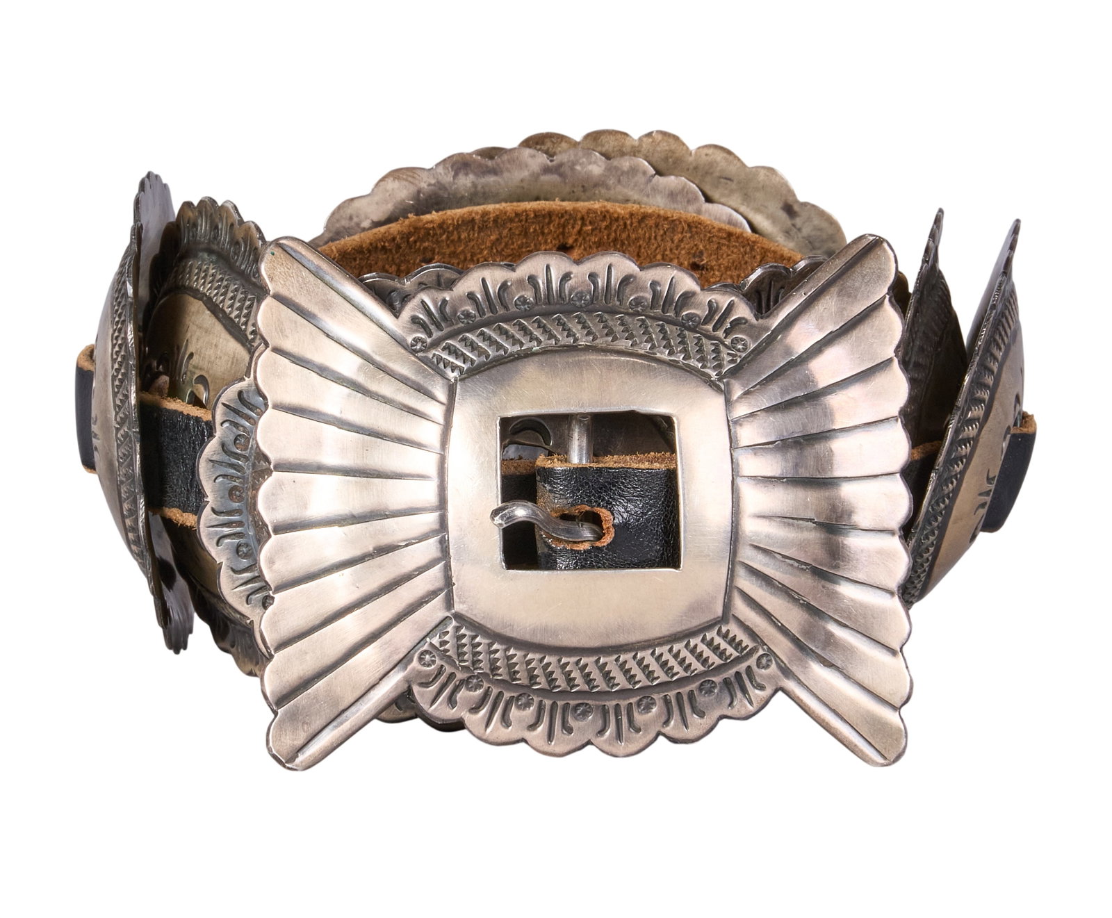 Sterling Silver Concho Belt: Sterling silver concho belt featuring eight conchos and buckle on black leather belt Length: 47 in. Total weight: 664.3 g Provenance: Property from a home in San Antonio, Texas