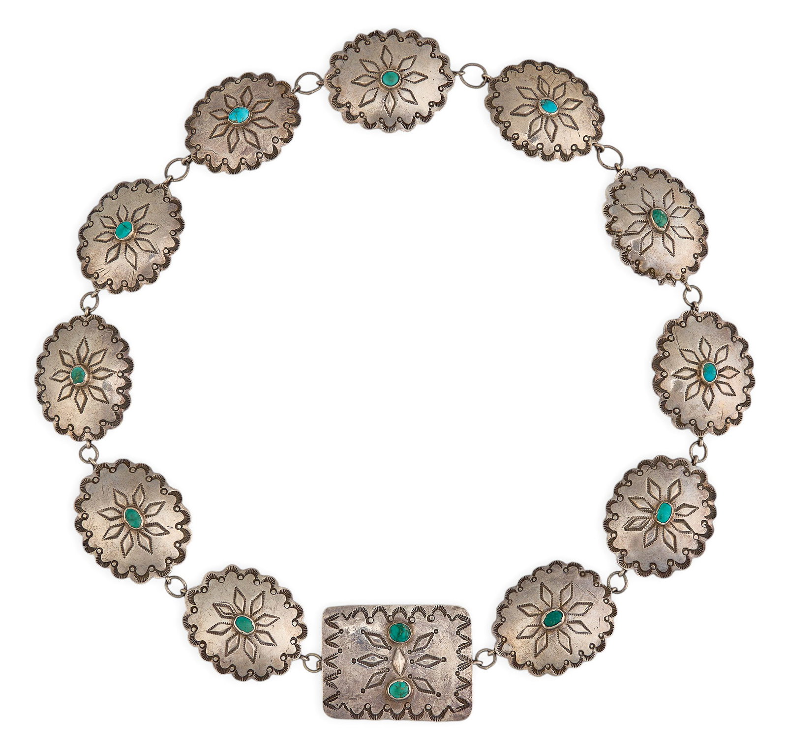 Navajo Sterling & Turquoise Concho Belt: Navajo sterling silver concho belt, set with turquoise cabohons and hand-stamped details Length: 28.5 in. Total weight: 156.7 g Provenance: Property from a home in San Antonio, Texas