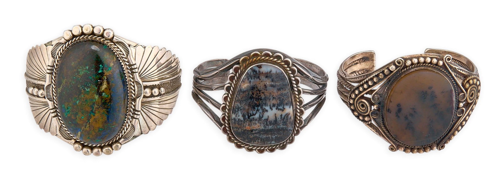 (3) Sterling & Agate Cuffs: Three sterling silver cuff bracelets, each set with large agate cabochon, twisted wire motifs, and stamped details, marked Circumference: 6.75 in. / largest Total weight: 187.1 g Provenance: Property 