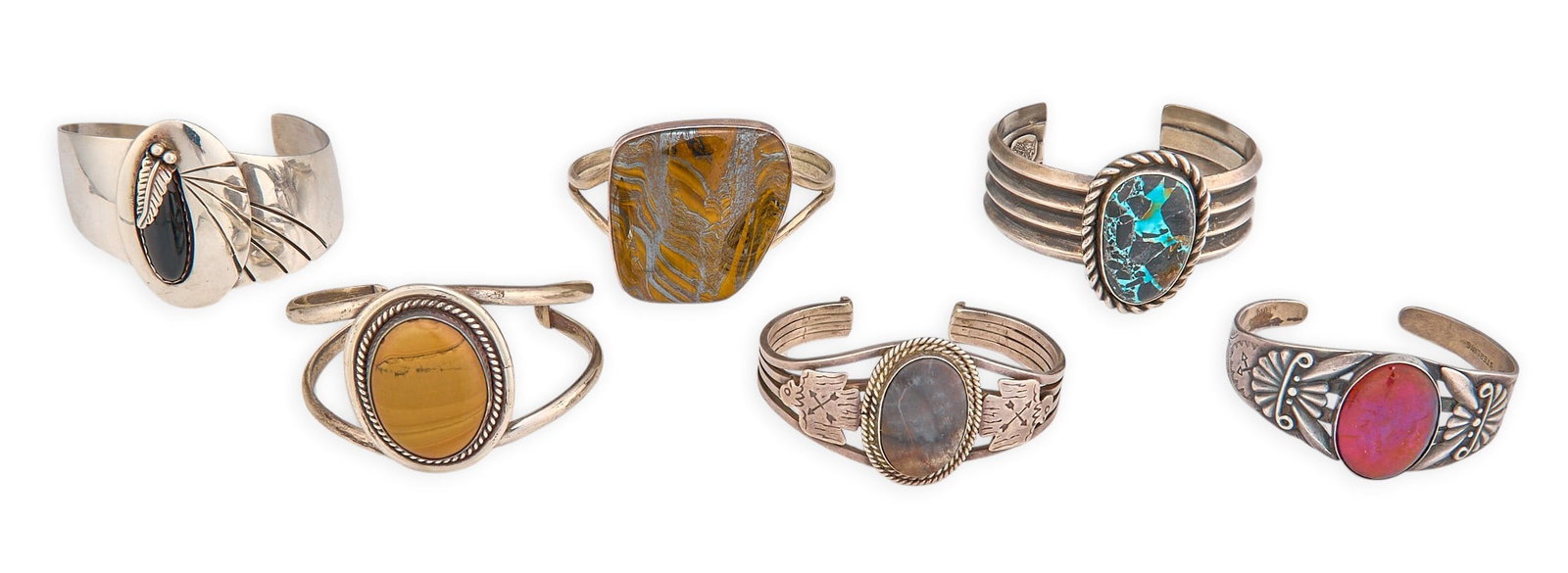(6) Sterling & Hardstone Cuffs: Six Southwestern sterling silver cuffs, each set with hardstone cabochon, featuring twisted wire motifs and stamped details, most marked Circumference: 6.5 in. / largest Total weight: 264.8 