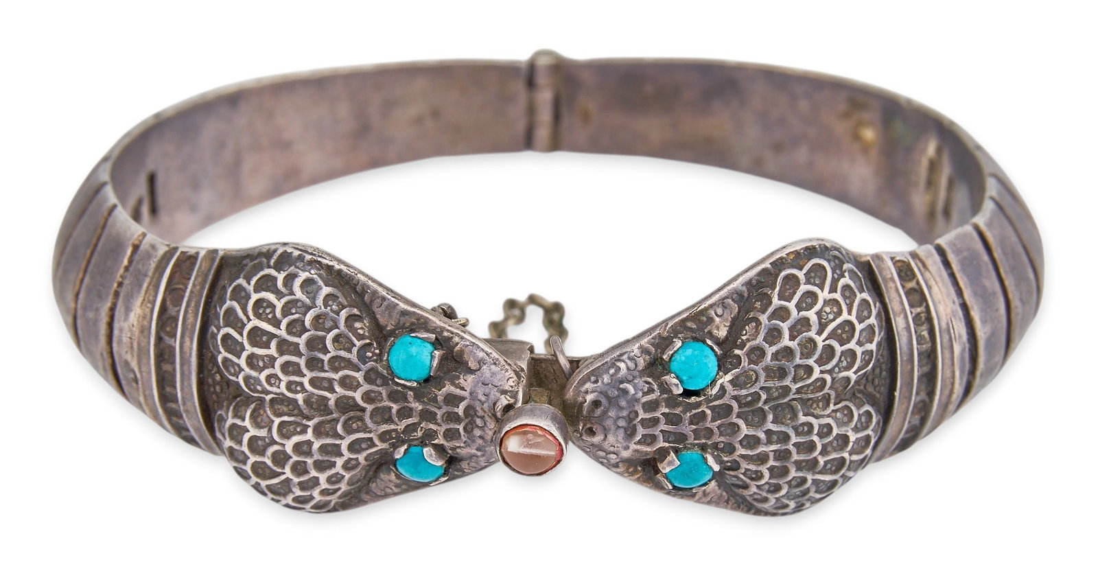 Taxco Sterling Silver Turquoise Snake Bracelet: Vintage Taxco sterling silver hinged cuff bracelet featuring double snake head motif, set with turquoise cabochons, with safety chain, marked "Hecho en Mexico" and "Sterling" Circu