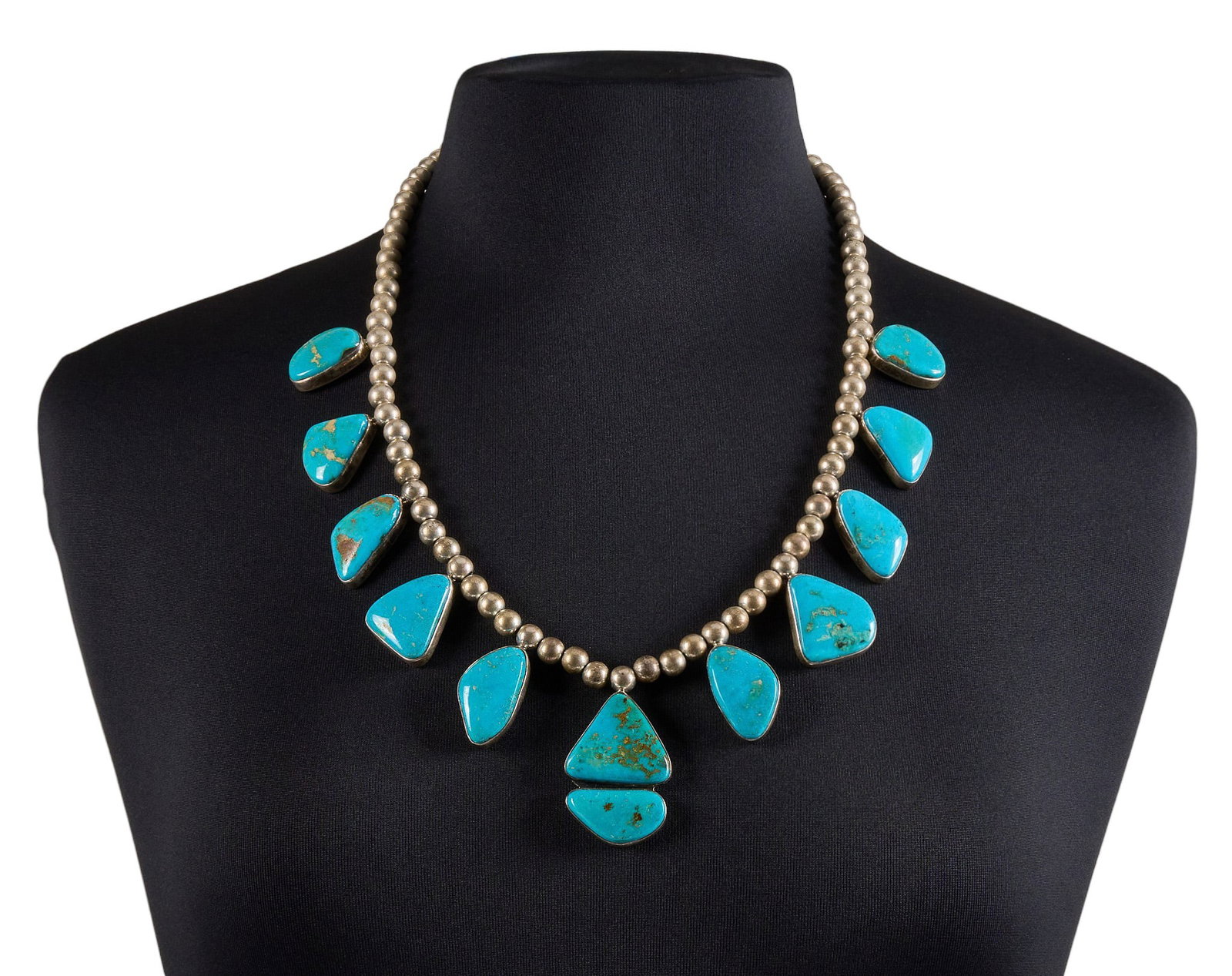Joe Piaso Jr., Navajo Sterling & Turquoise Necklace: Joe Piaso Jr., Navajo sterling silver beaded station necklace, set with turquoise cabochons in bezel settings, with hook and eye closure, marked "J Piaso Jr Sterling" Length: 25 in. Total we
