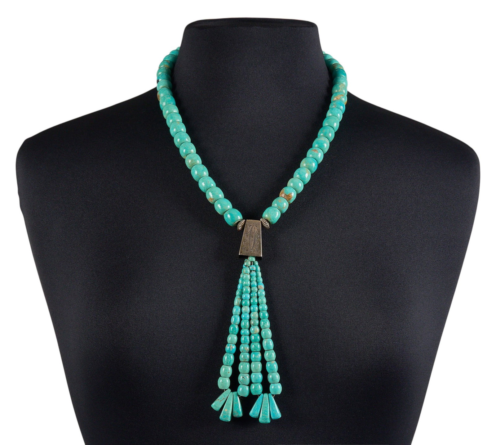 Navajo Beaded Turquoise Necklace: Milton Tsosie, Navajo beaded turquoise necklace featuring sterling silver pendant and two beaded turquoise jaclas, with hook and eye closure, marked "MT" Length: 22 in. Total weight: 141.3 g