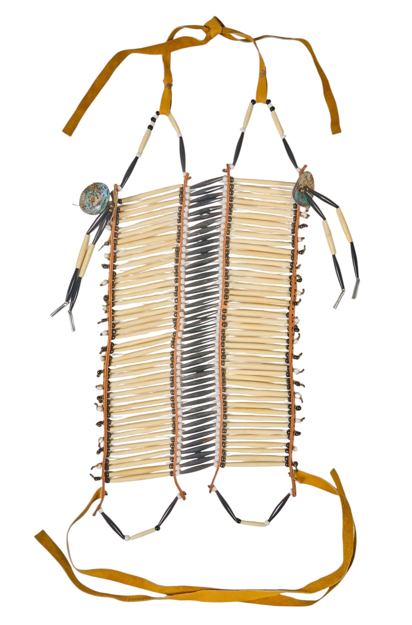 Souix Breastplate: Souix breastplate, with buffalo ivory, elk bone, glass beads, and buckskin leather length 33 in. x width 30 in. Provenance: Property from a home in Boerne, Texas 