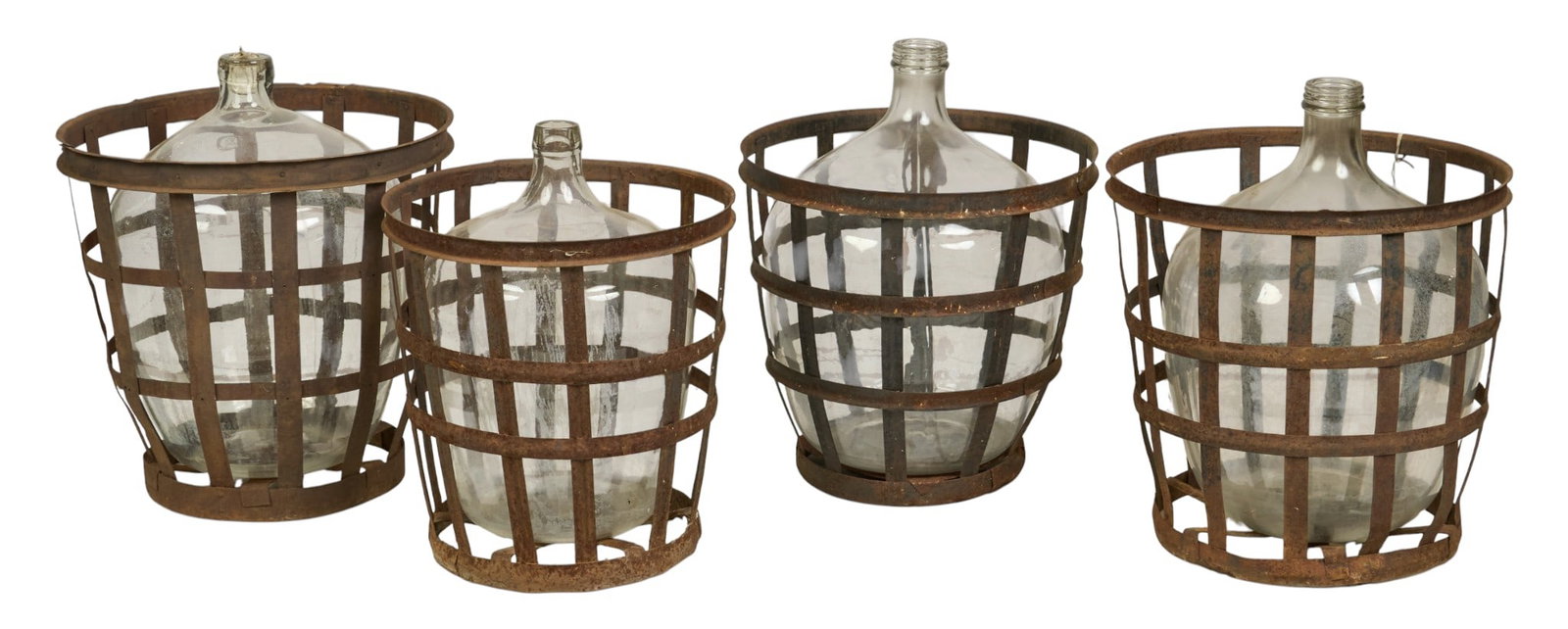 (4) Demijohns: Four hand-blown clear glass demijohns encased in rustic iron-strap baskets with a weathered patina height 26.5 in. x width 20.5 in. x depth 20.5 in. / largest