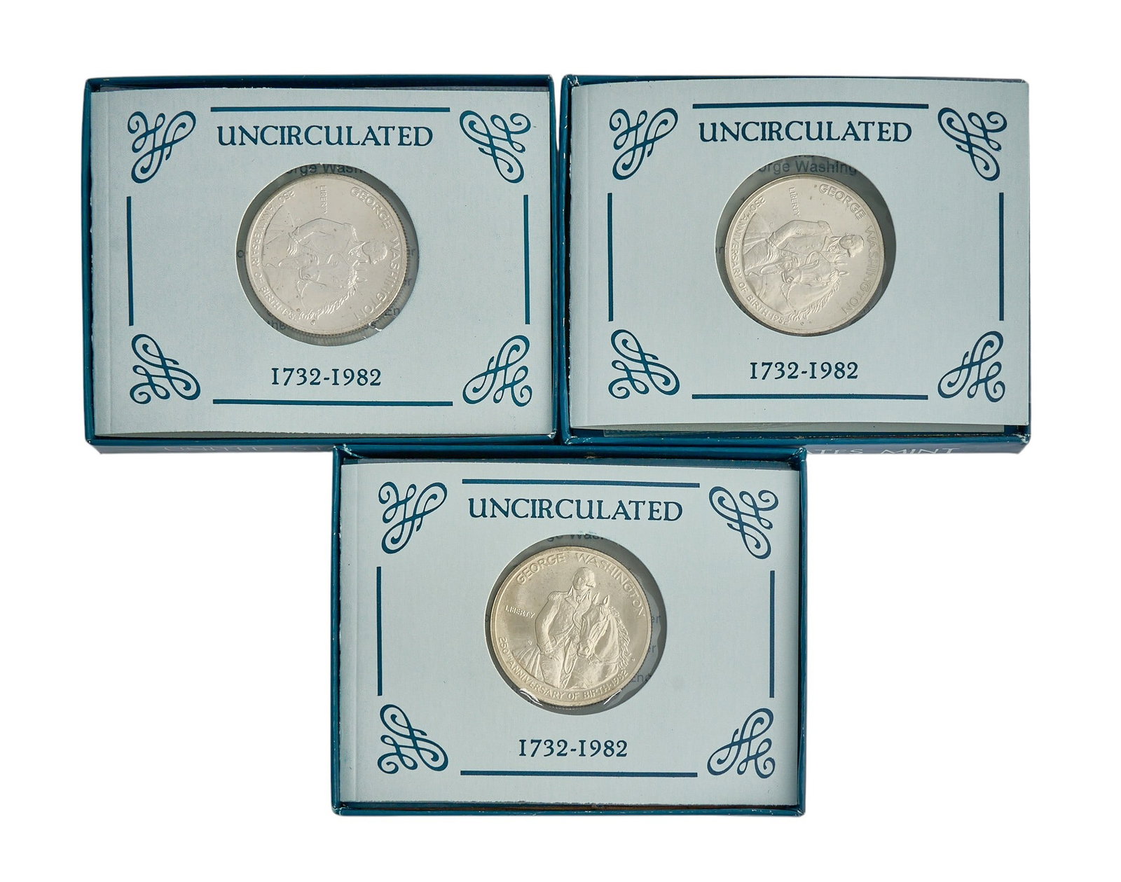 (3) 1982 Uncirculated George Washington Commemorative Half Dollars: Three 1982 Uncirculated George Washington Commemorative half dollars, each .3617 troy ounce .900 silver, in original box Provenance: Property from a home in San Antonio, Texas