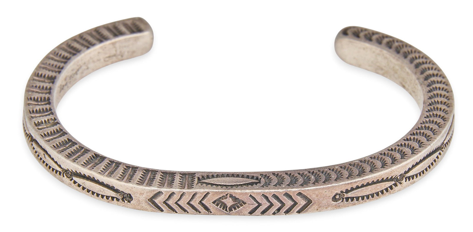 Mario Madrid, Sterling Silver Cuff: Mario Madrid, Southwestern style sterling silver cuff bracelet featuring stamped details throughout, marked "Mario Madrid Sterling" Circumference: 6.5 in. Total weight: 46.1 g Prov